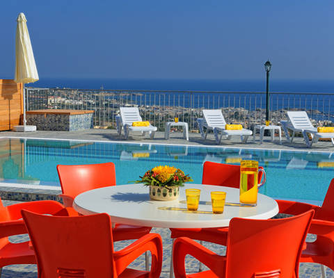 Danae Villas Hersonissos Crete Red Villa poolside table, sunbeds and pool