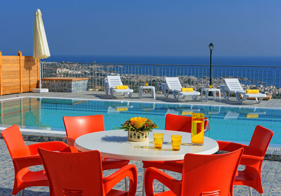 Danae Villas Hersonissos Crete Red Villa poolside table, sunbeds and pool