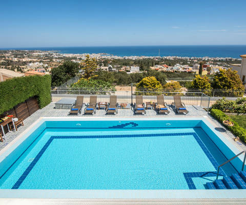 Danae Villas Hersonissos Crete Yellow Villa pool and sunbeds and great view in the background