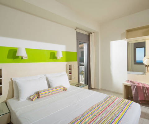 Danae Villas Hersonissos Crete Blue Villa double bedroom with lime green paint decoration