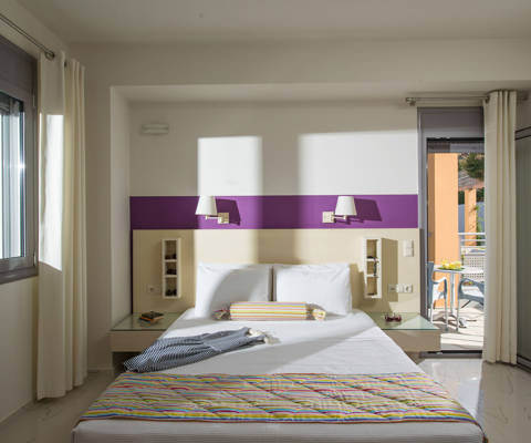 Danae Villas Hersonissos Crete Green Villa double bedroom bed and terrace view