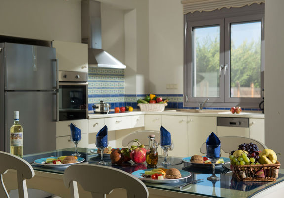 Danae Villas Hersonissos Crete Blue Villa kitchen and table full of breakfast