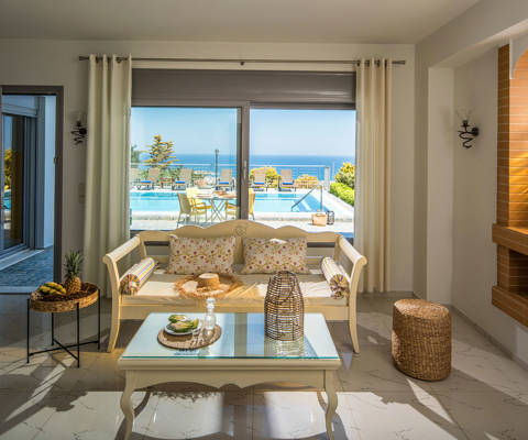 Danae Villas Hersonissos Crete Yellow Villa living room with pool view