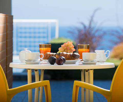 Danae Villas Hersonissos Crete Yellow Villa terrace table full of breakfast