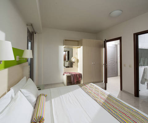 Danae Villas Hersonissos Crete Blue Villa double bedroom with lime green paint decoration