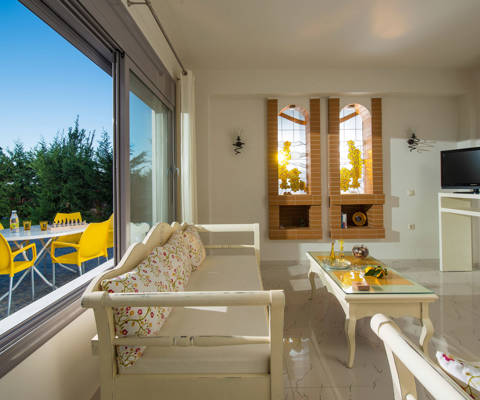 Danae Villas Hersonissos Crete Yellow Villa living room with pool view