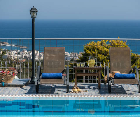 Danae Villas Hersonissos Crete Yellow Villa sunbeds and view of the sea in the background