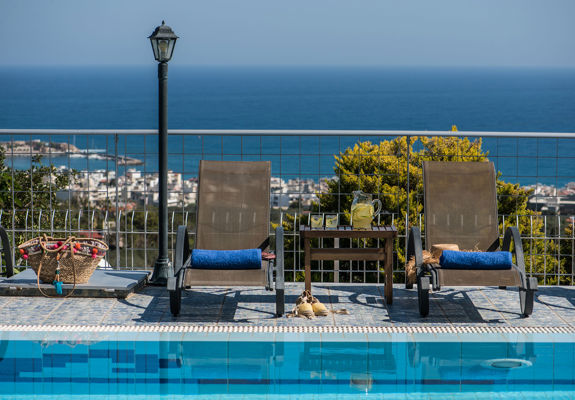 Danae Villas Hersonissos Crete Yellow Villa sunbeds and view of the sea in the background