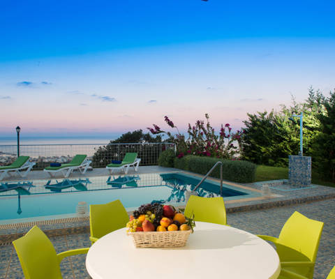 Danae Villas Hersonissos Crete Green Villa poolside table, pool and sunbeds