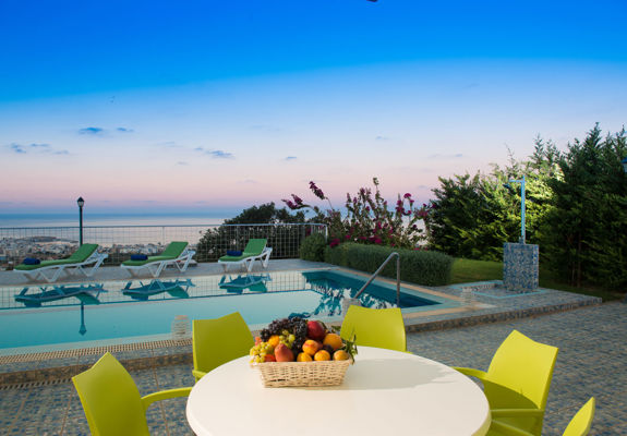 Danae Villas Hersonissos Crete Green Villa poolside table, pool and sunbeds
